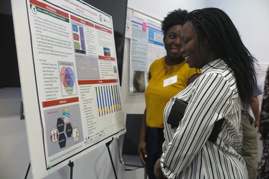 VeeAnder Mealing, PhD student at Colorado School of Mines, describes her research to colleagues.