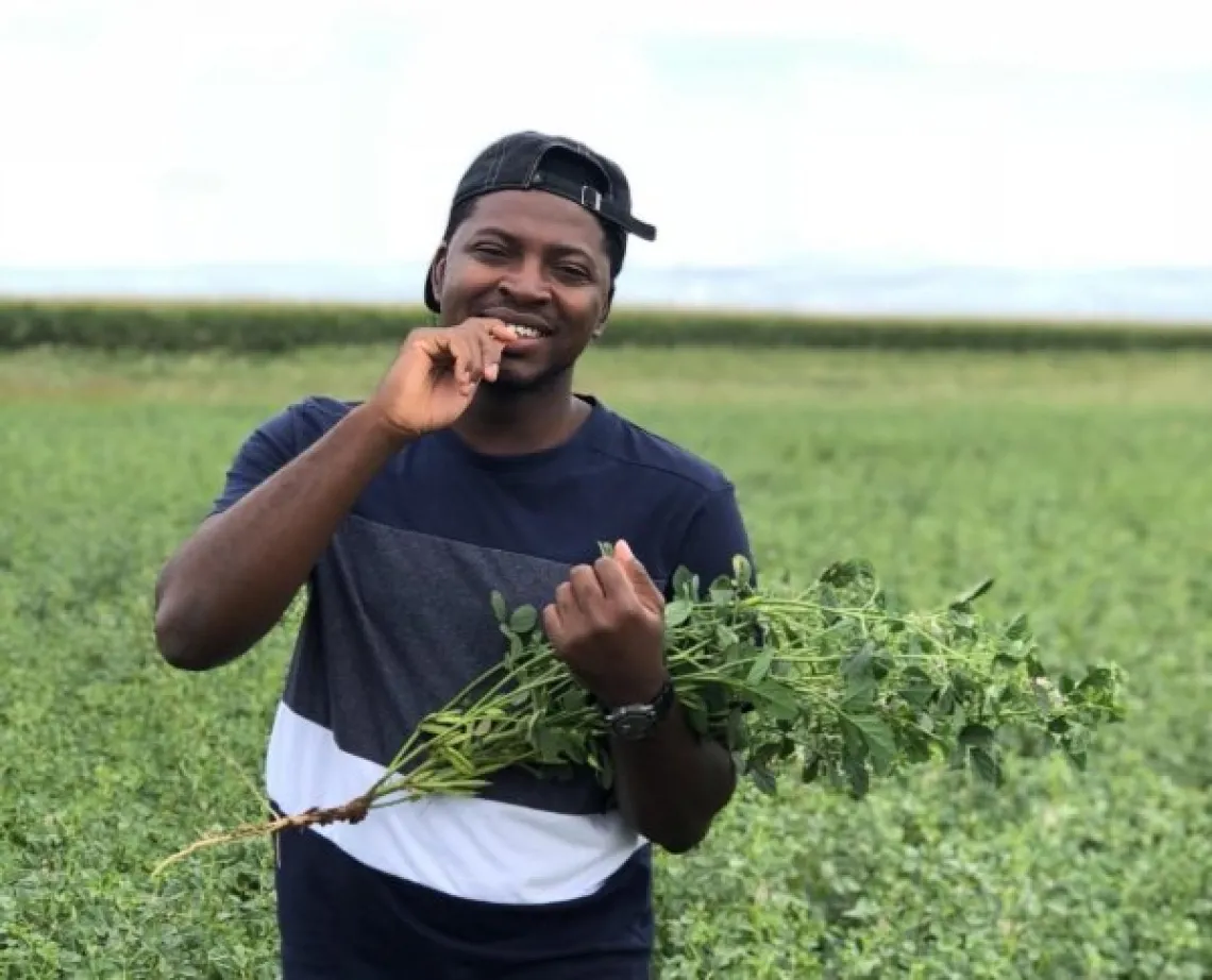 SBAR student – Meshack Audu – in a guar research field at the NMSU Agricultural Science Center in Clovis, New Mexico